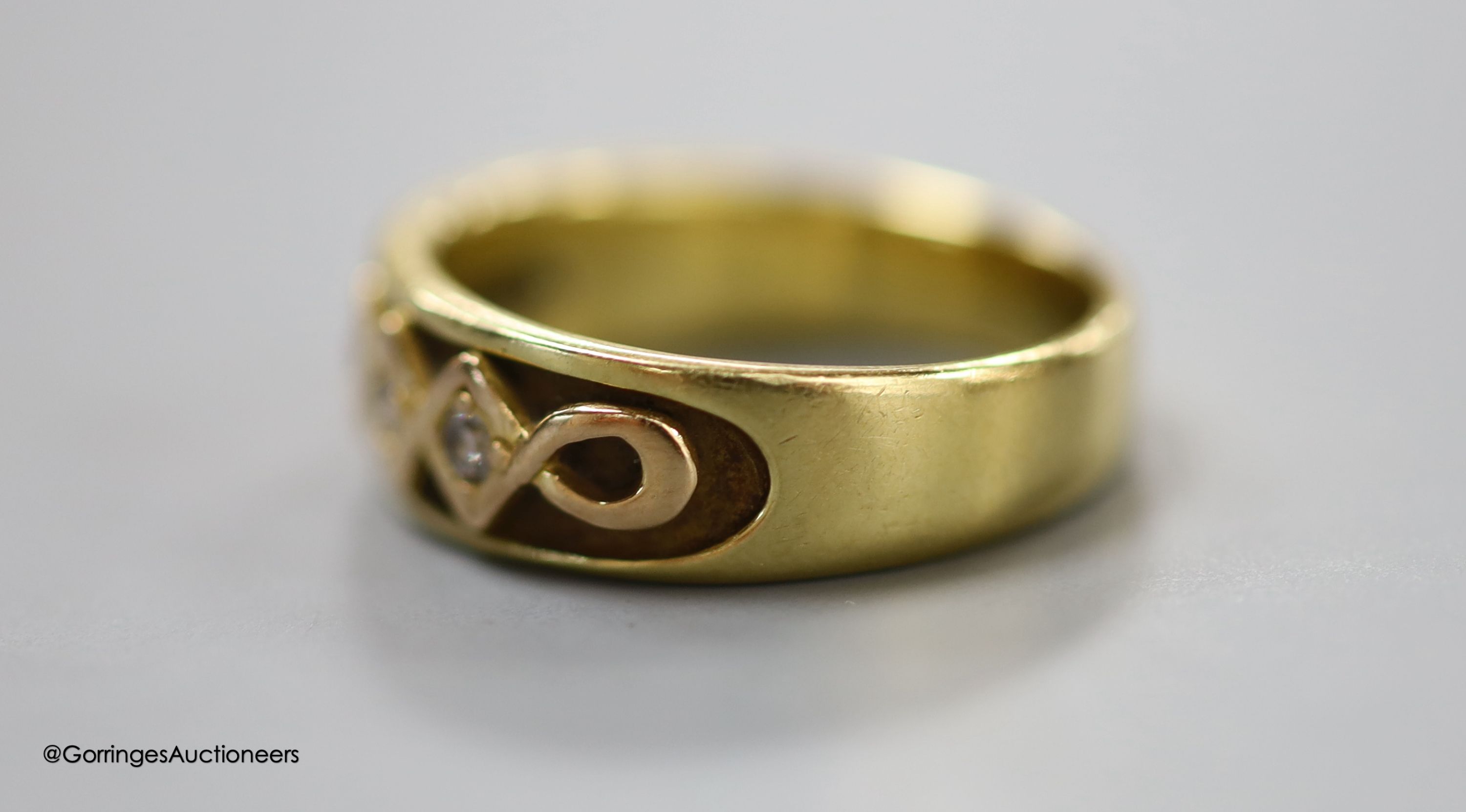 An 18ct gold five-stone diamond ring, gross 6.2g